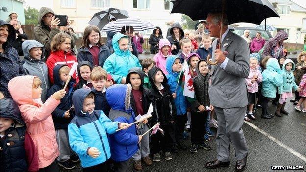 A crowd greets Prince Charles as he visits Llandovery Hospital to unveil a new x-ray machine