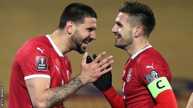 Aleksandar Mitrovic (left) celebrates scoring Serbia's third goal with Dusan Tadic (right)