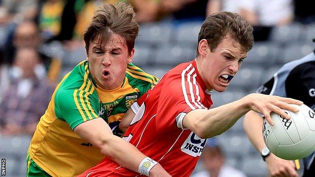 Donegal's Peadar Mogan challenges Cork's Cathal Maguire