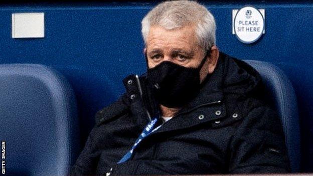 Warren Gatland wears a mask as he watches a Six Nations match at Murrayfield