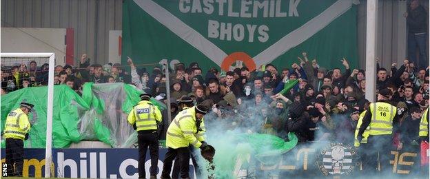 Smoke-bombs thrown by Celtic fans had to be cleared from the pitch before kick-off