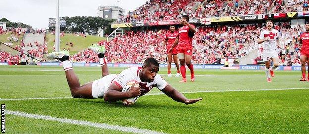 Jermaine McGillvary slides in to score against Tonga in England's World Cup semi-final