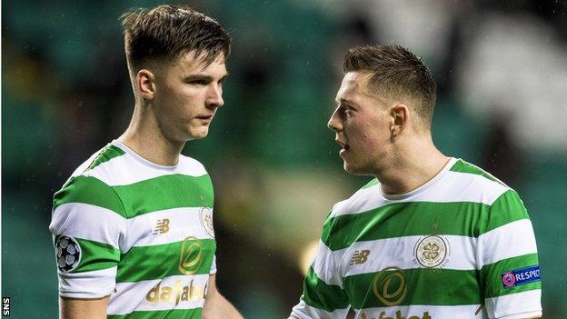 Kieran Tierney and Callum McGregor console each other after Celtic's defeat by Bayern Munich