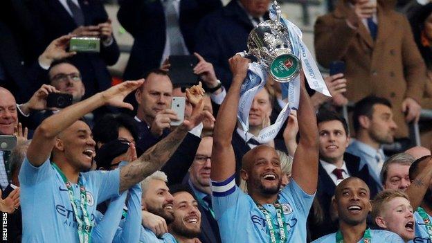 Manchester City captain Vincent Kompany lifts the Carabao Cup