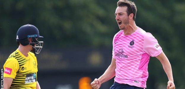 Tony Roland-Jones celebrates taking a wicket against Glamorgan