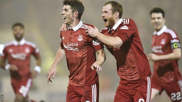 Mark Reynolds, right, congratulates Ryan Christie after his wonder goal in the 7-2 win over Motherwell