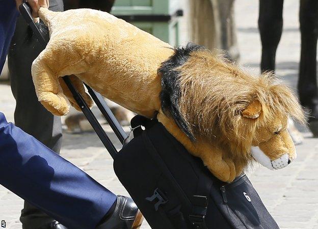 England's Chris Smalling carrying the team mascot