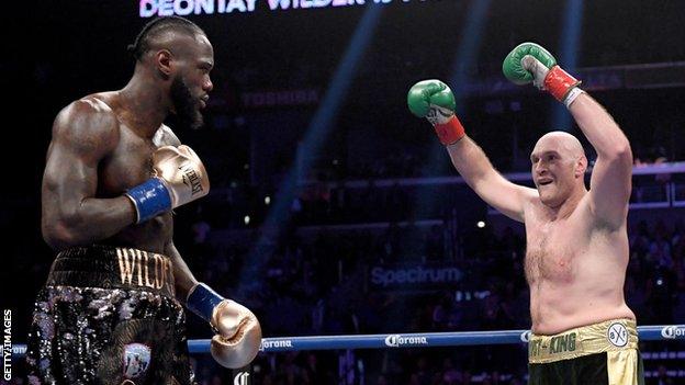 Deontay Wilder and Tyson Fury in the ring