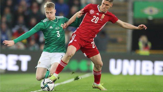 NI defender Paddy Lane tackles Hungary's Roland Sallai