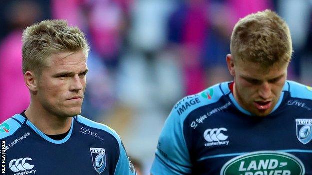 Gareth Anscombe and Macauley Cook are despondent after defeat in Paris