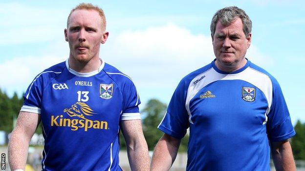 Hyland walks to the dressing room with Cian Mackey after Cavan's qualifier defeat by Derry last month