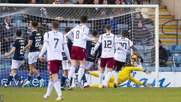 Michael McKenna heads home the game's opening goal