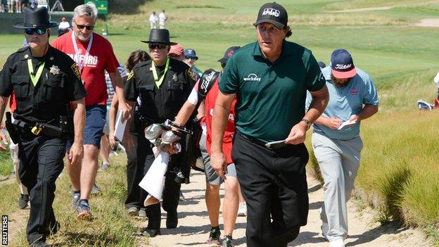 Phil Mickelson walks to the scorers hut after his third round at the 2018 US Open