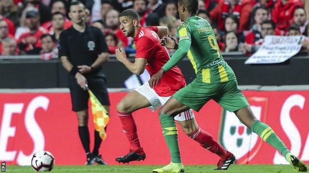 Benfica midfielder Adel Taarabt (centre) in action