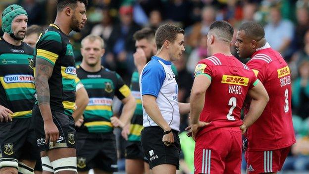 Referee Luke Pearce discusses the alleged eye gouging on Northampton's Michael Paterson with Harlequins captain Dave Ward and Kyle Sinckler