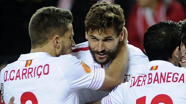 Fernando Llorente celebrates with his Sevilla team-mates