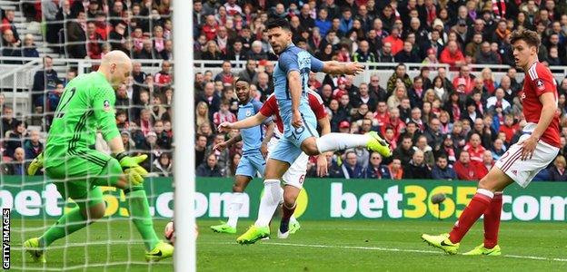 Middlesbrough goalkeeper Brad Guzan saves from Manchester City's Sergio Aguero