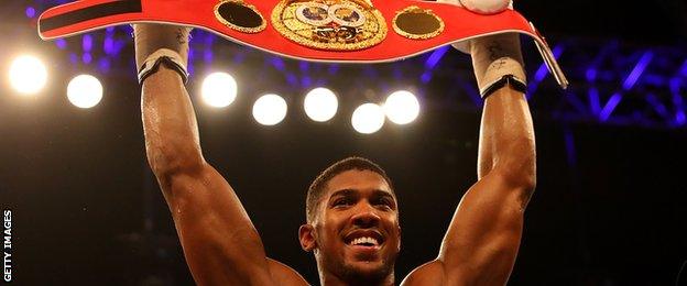 Anthony Joshua celebrates becoming world heavyweight champion