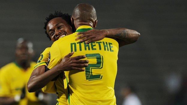 Percy Tau (L) celebrates his goal with Thabo Nthethe of Sundowns