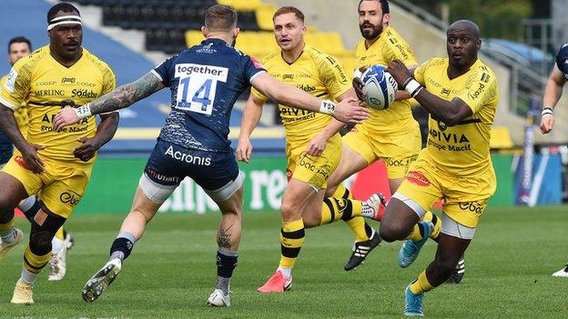 Raymond Rhule of La Rochelle runs through to score their third try