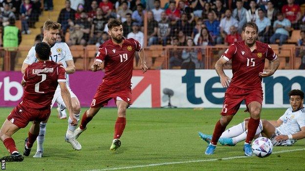 Scotland's Stuart Armstrong (second left) scores the equaliser