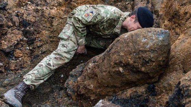 Army engineer working on the bomb