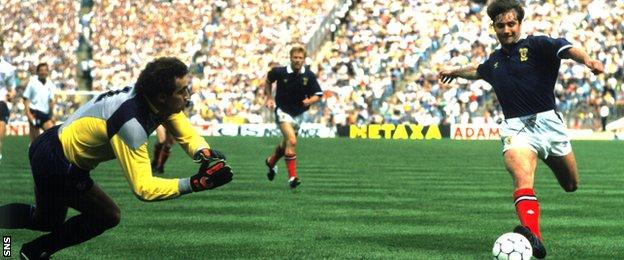 England's Peter Shilton moves in to save a shot from Scotland striker Ally McCoist