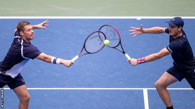 Neal Skupski and Jamie Murray go for the same ball at the 2019 US Open