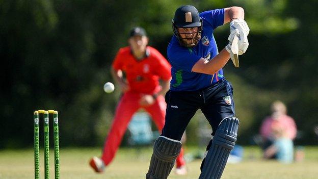 Warriors batsman William McClintock plays a shots against Munster Reds on Saturday