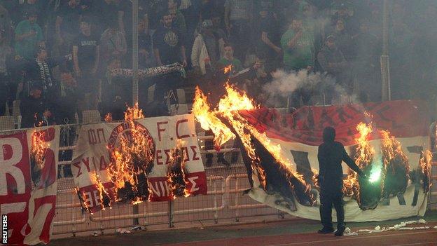 Flags burn at Panathinaikos