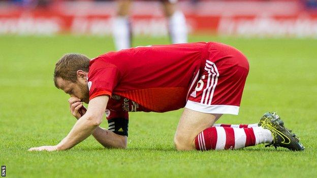 Aberdeen captain Mark Reynolds with a bleeding nose