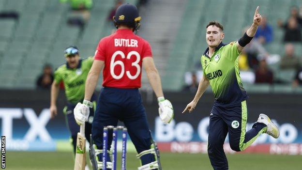 Josh Little celebrates dismissing England captain Jos Buttler in the five-run win in Melbourne