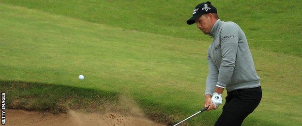 Hnerik Stenson playing out of a bunker on the 16th hole