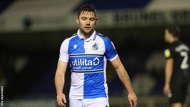 Bristol Rovers' Sam Finley walks off the pitch after being shown red against Port Vale