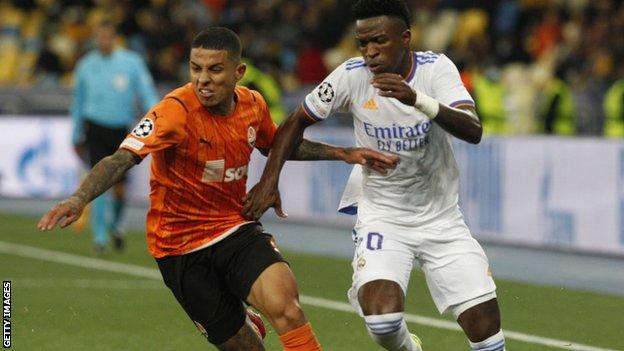 Vinicius Junior challenges for the ball for Real Madrid