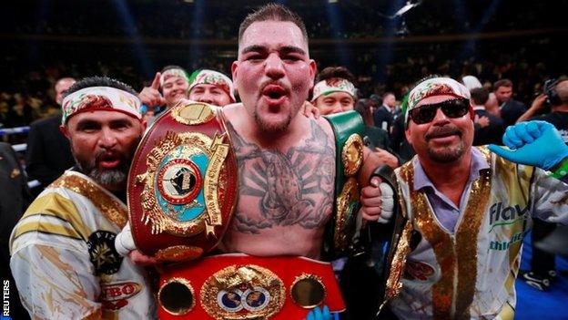 Andy Ruiz Jr with three heavyweight title belts