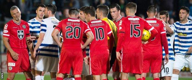 The Morton and St Mirren players exchange views after an incident involving Jim Goodwin