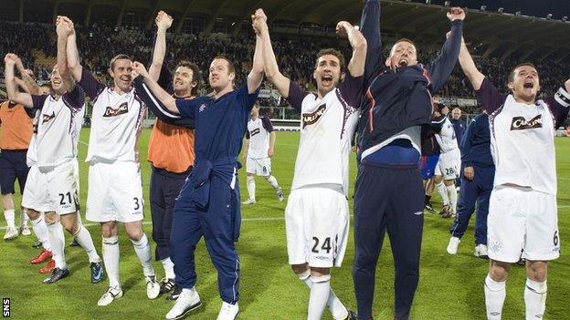 Rangers players celebrate in front of their fans in Florence after edging past Fiorentina to reach the 2008 Uefa Cup final