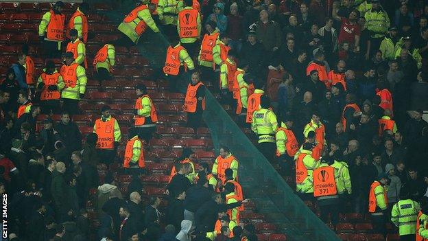 Liverpool and Manchester United fans during a Europa League game.