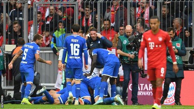 Hoffenheim players celebrate scoring against Bayern Munich