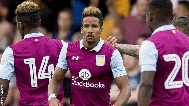 Scott Sinclair celebrates with Aston Villa against Cambridge United in pre-season