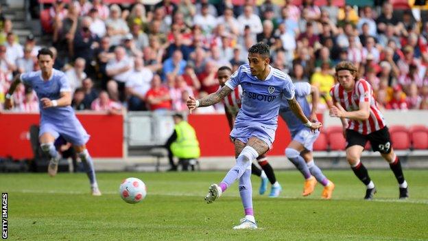 Raphinha scores a penalty against Brentford on the final day of the season