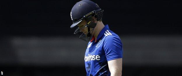 Eoin Morgan walks off after being dismissed