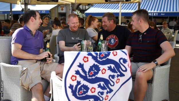 England fans drink in a bar before the game