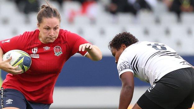 Amy Cokayne runs with the ball