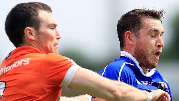 Brendan Donaghy of Armagh challenges Cavan's David Givney