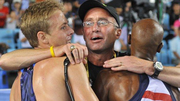 US coach Alberto Salazar (centre) hugs Mo Farah (right) and US athlete Galen Rupp (left)