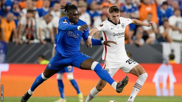 Rangers' Calvin Bassey and Frankfurt's Jesper Lindstrøm during the UEFA Europa League Final between Eintracht Frankfurt v Rangers at the Ramon Sanchez Pizjuan Stadium