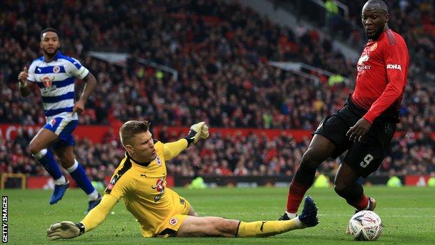 Romelu Lukaku of Man Utd goes around Reading goalkeeper Anssi Jaakkola