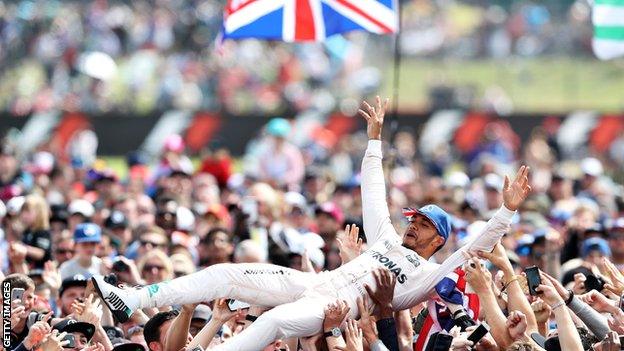 Lewis Hamilton goes crowd-surfing after winning the 2016 British Grand Prix